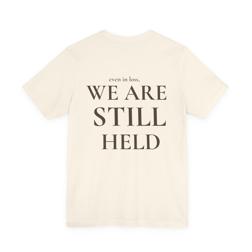 We Are Still Held Tee | Heaven Held Signature Shirt