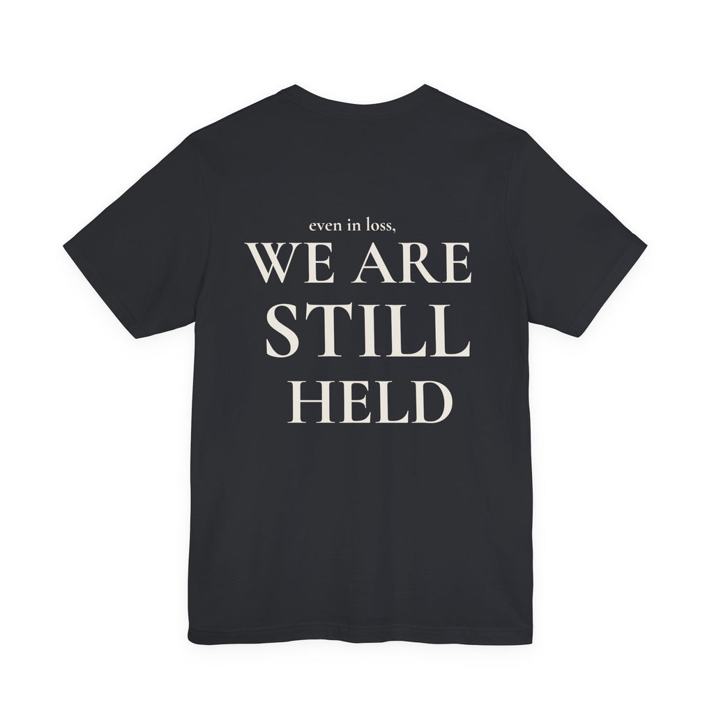 We Are Still Held Tee | Heaven Held Signature Shirt