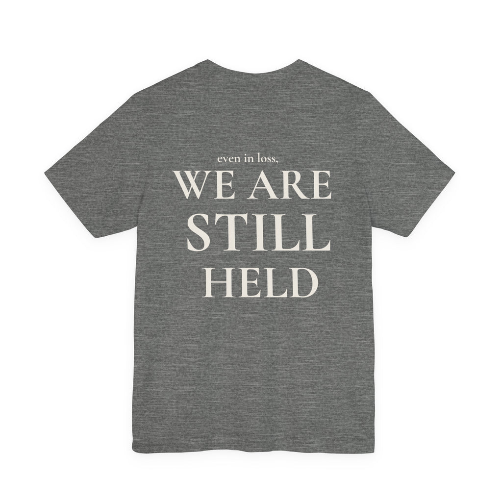 We Are Still Held Tee | Heaven Held Signature Shirt